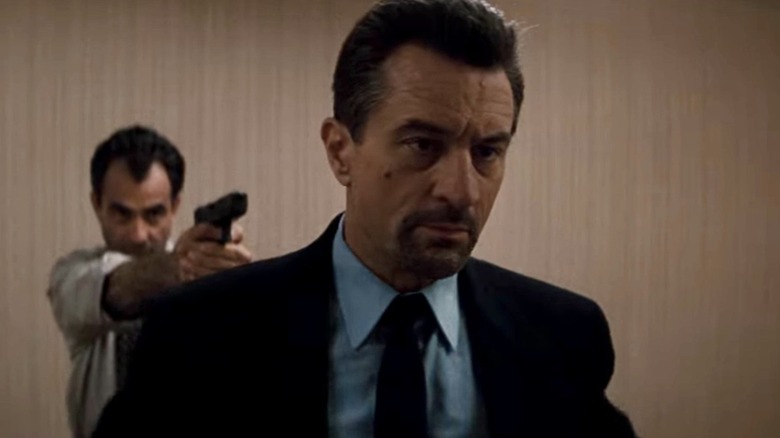 De Niro with gun pointed at head 