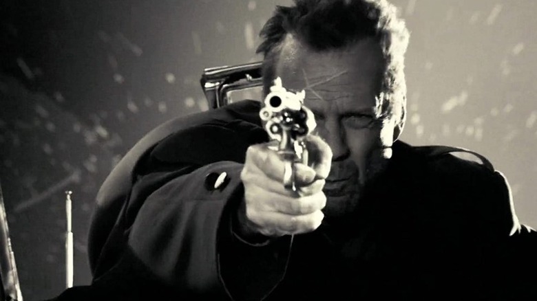 Bruce Willis pointing gun 