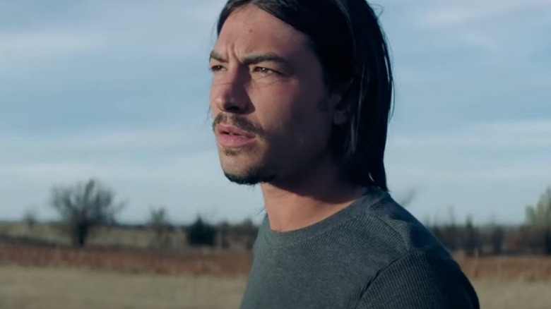 Miller standing outside in a field