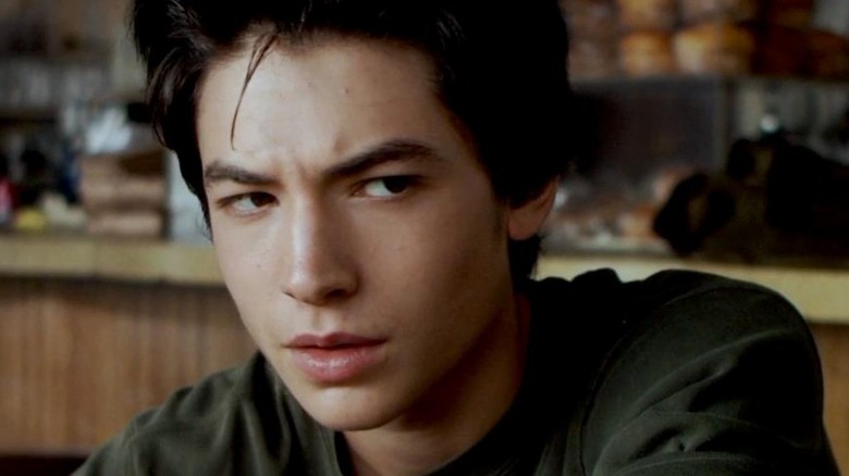 Ezra Miller looking shifty