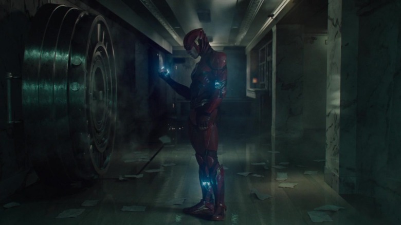 The Flash standing in a bank vault