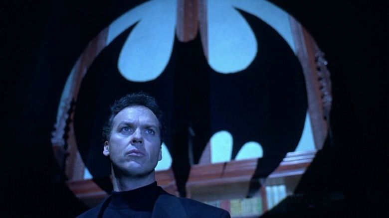 Bruce Wayne in front of Bat-signal