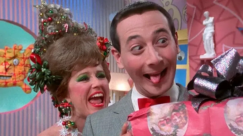 Pee-Wee Herman holding a present