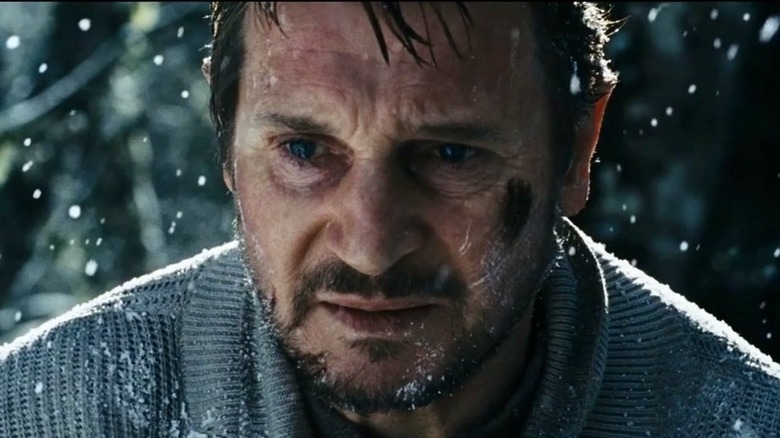 Liam Neeson preparing to fight against wolves