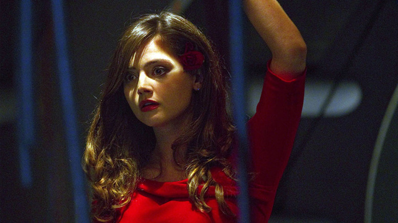 Oswin Oswald raises her arm