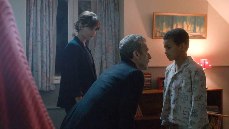 The Doctor and Clara talk to a young boy