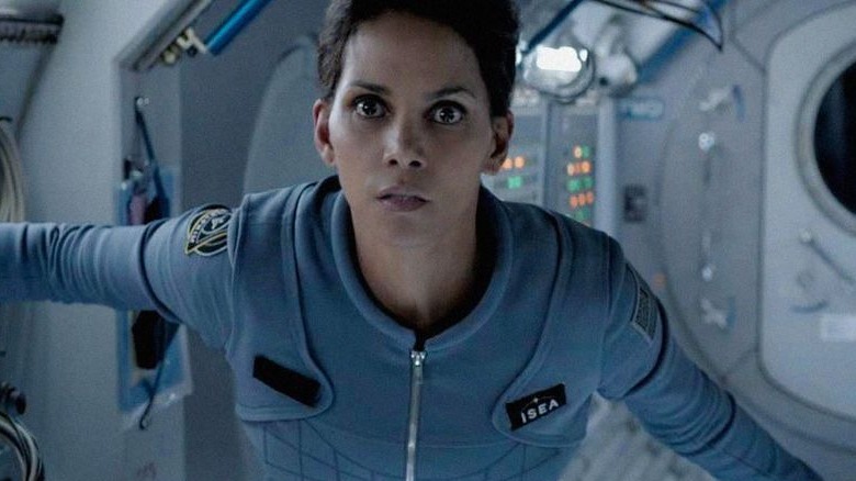 Extant Halle Berry floating in a space station