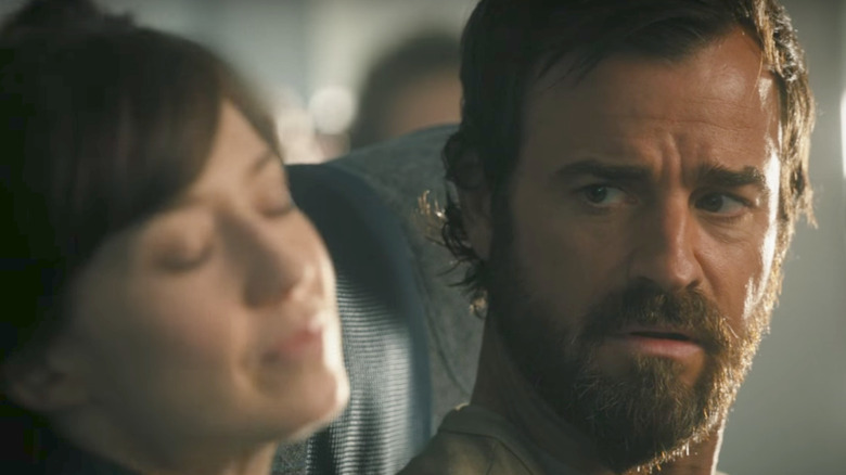 Justin Theroux sitting in an airplane cabin The Leftovers