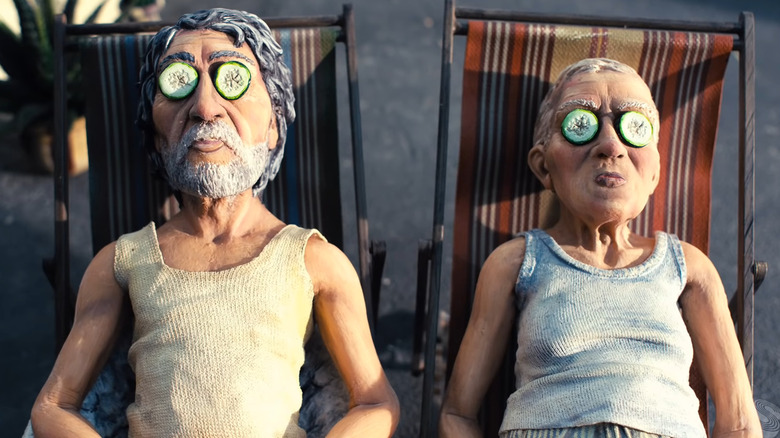 Two older men with cucumbers on their eyes