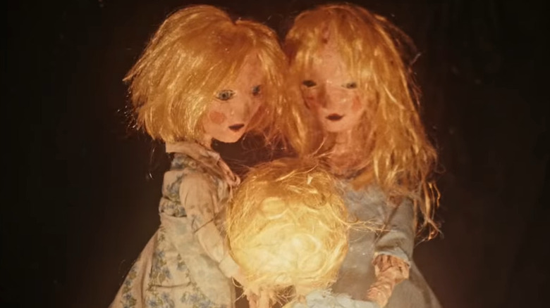 Three straw-haired puppets