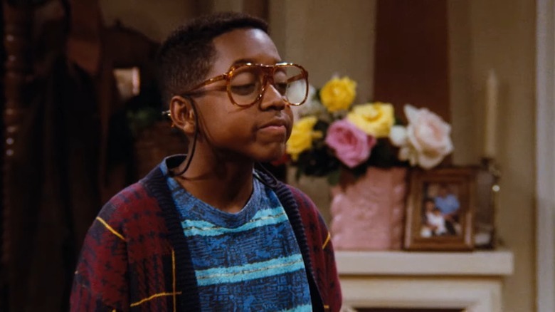 Family Matters' Steve Urkel gazing forward with a resigned expression