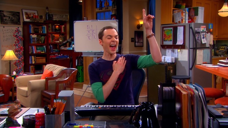 The Big Bang Theory's Sheldon Cooper singing a high note while pointing up