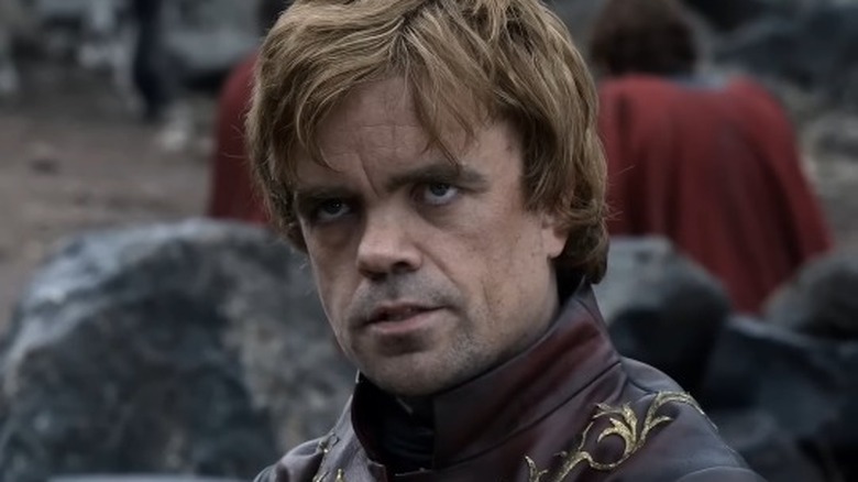 Tyrion Lannister looking up and furrowing his brows