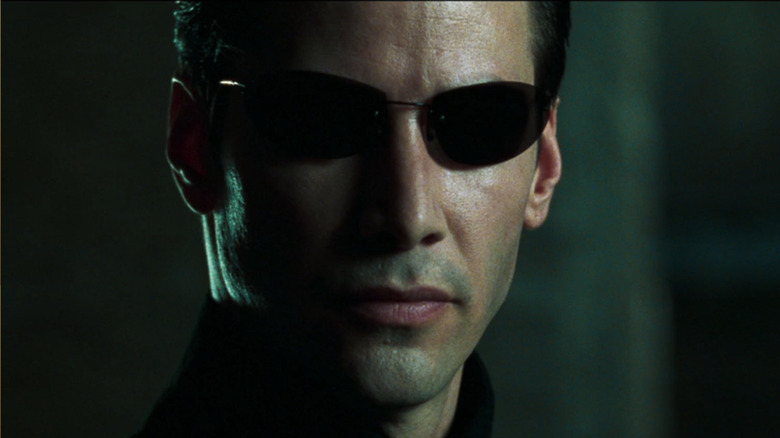 Neo wearing sunglasses