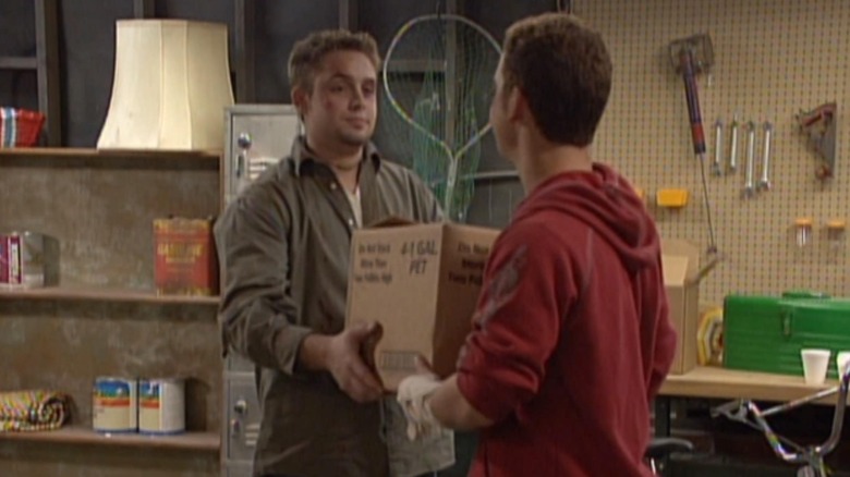 Eric hands Cory a box