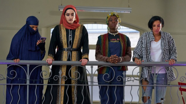 Lady Parts band members looking over railing