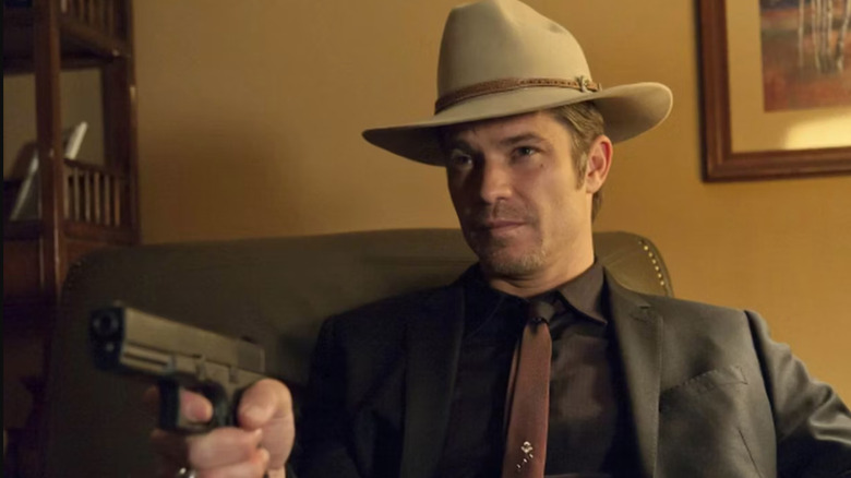 Timothy Olyphant aiming gun