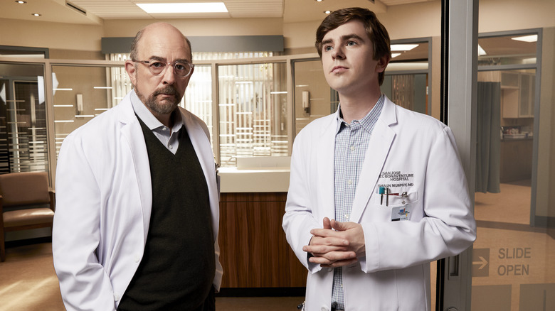 Freddie Highmore and Richard Schiff posing