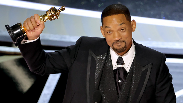 Smith accepting his Oscar