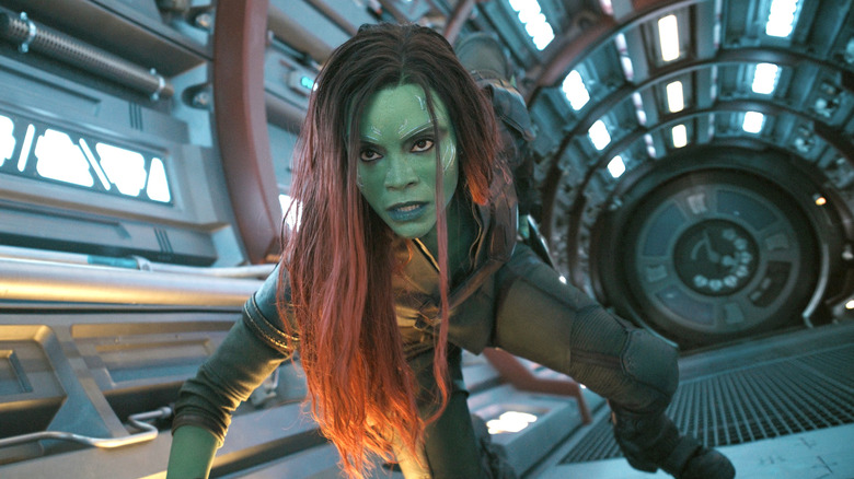 Gamora crouching on ground in hallway