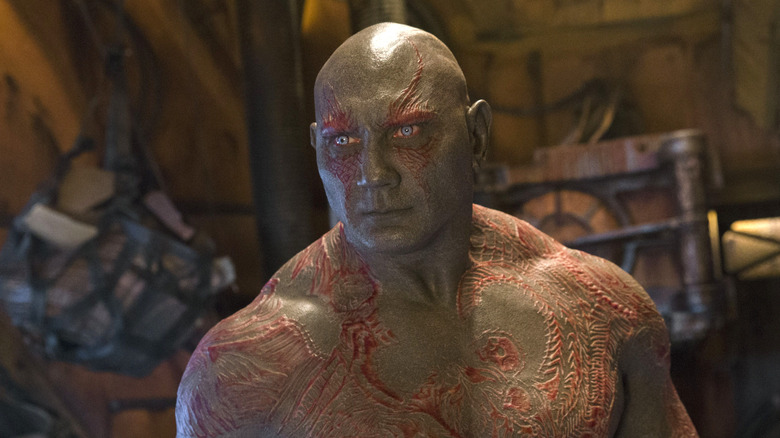 Drax standing and looking