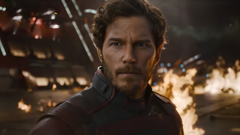 Peter Quill staring in front of fire