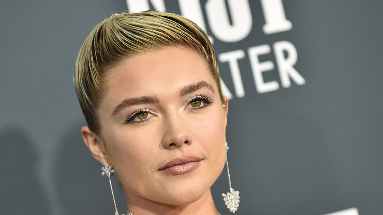 Florence Pugh with short hair quiff at a premiere