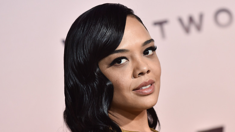 Tessa Thompson with long black hair on the red carpet