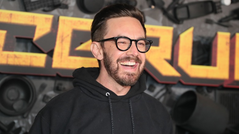 Jorma Taccone laughing in a hoodie