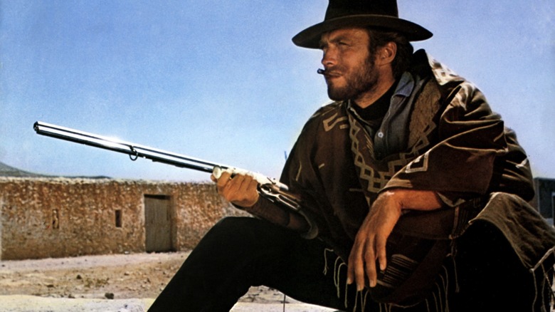 "Joe," The Man With No Name, holding a Volcanic Repeater Rifle while sitting in For a Few Dollars More