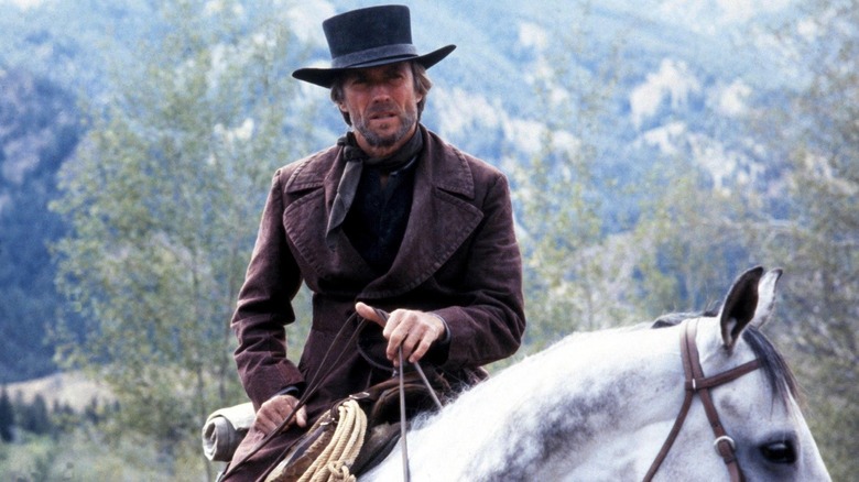 The Preacher riding his white horse in Pale Rider