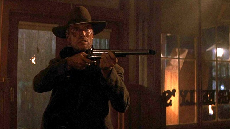 William Munny pointing his Spencer 1860 Saddle Ring Carbine in a saloon in Unforgiven