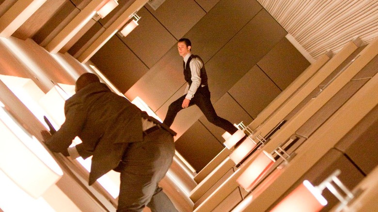 Arthur fights a man in a rotating hallway in "Inception" (2010)