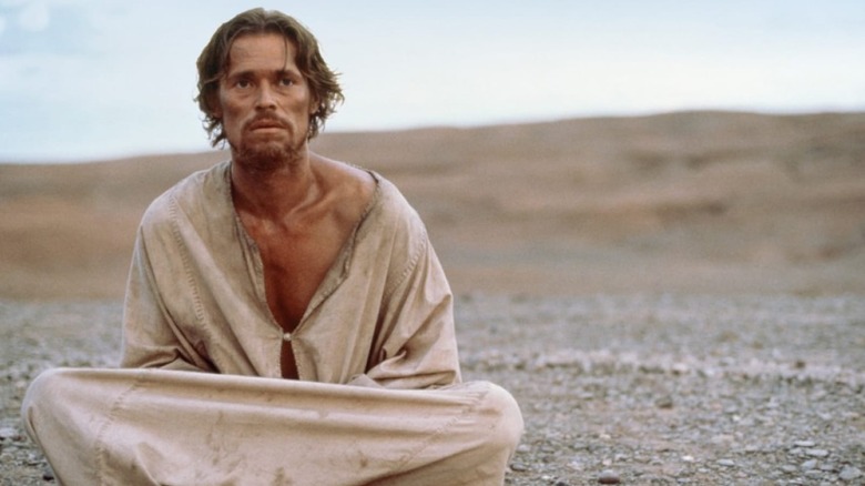 Jesus sits in the desert in "The Last Temptation of Christ" (1988)