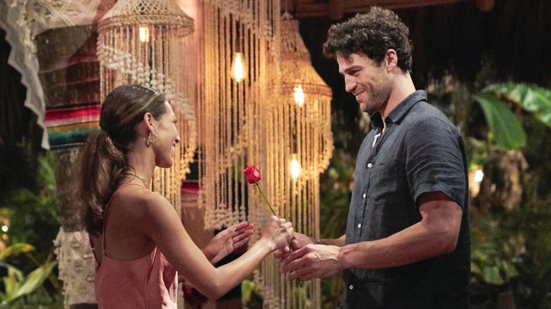 "Bachelor in Paradise" Season 7 contestant Joe Amibile giving a rose to future wife Serena Pitt