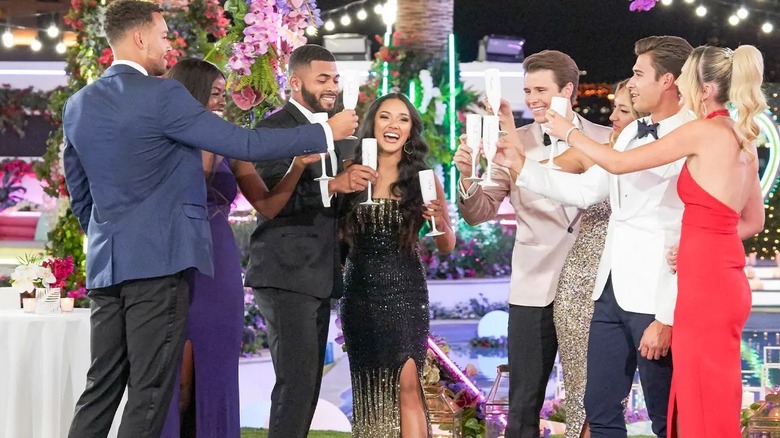 "Love Island USA" contestants making a toast