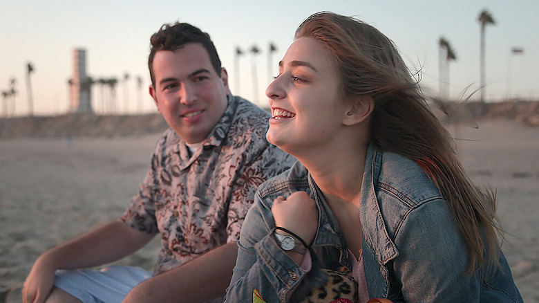 "Love on the Spectrum" Season 2 couple David and Abbey watching the sunset while sitting on the beach