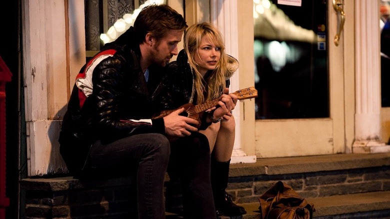 Dean playing ukelele sitting next to Cindy in Blue Valentine