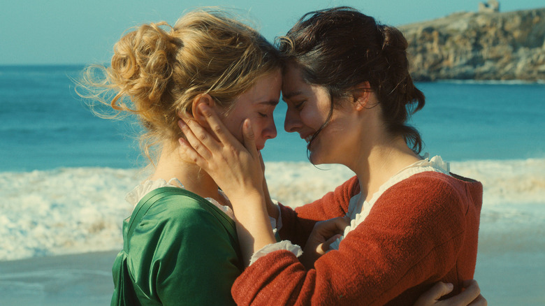 Héloïse and Marianne pressing their foreheads together on a beach in Portrait of a Lady on Fire