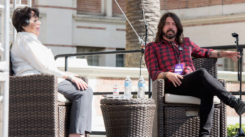 Virginia and Dave Grohl sitting on stage