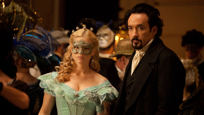 Poe next to masked Emily