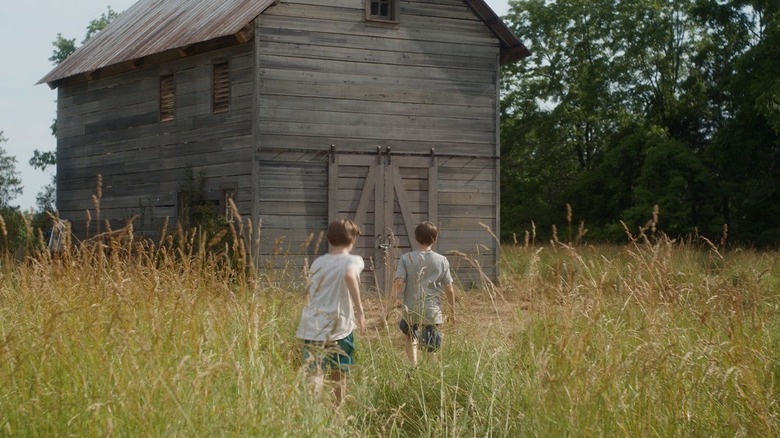 Elias and Lukas heading towards the barn