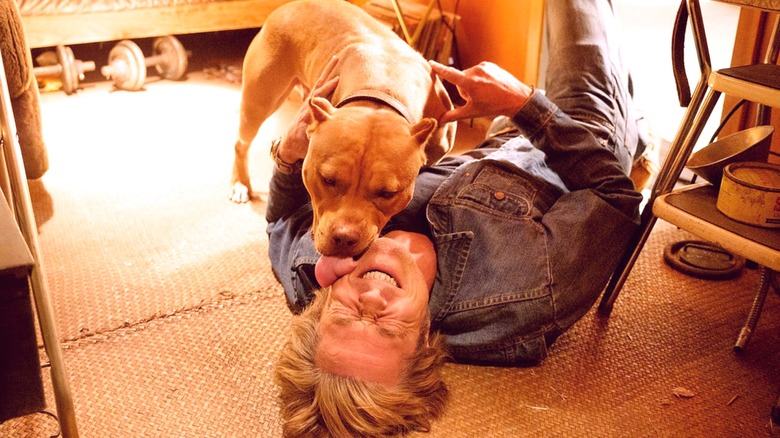 Brandy kissing Cliff on floor