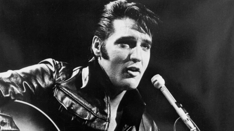 Elvis in front of a microphone