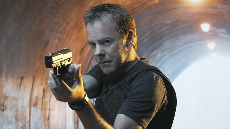 Jack Bauer holding a gun on 24