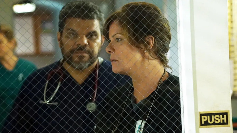 Leanne and Mama behind a window in the hospital on Code Black