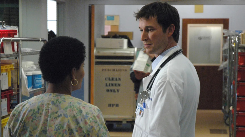 Dr. Carter speaking to a nurse on ER