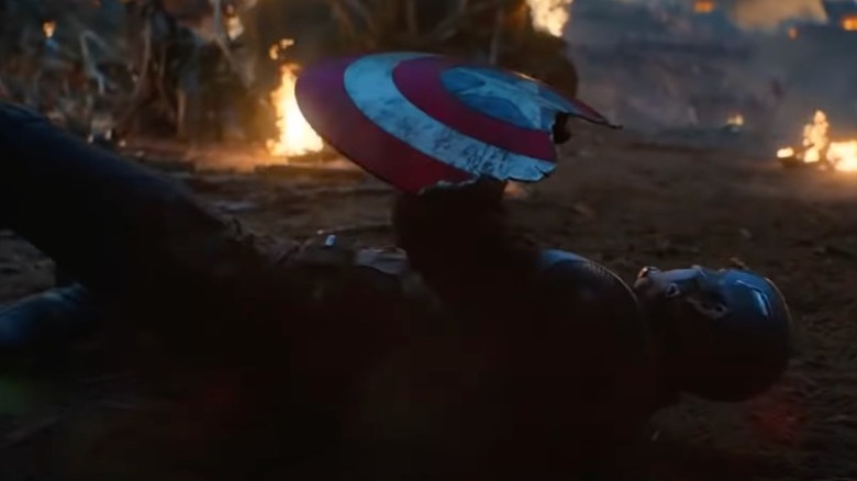 Cap holds his broken shield