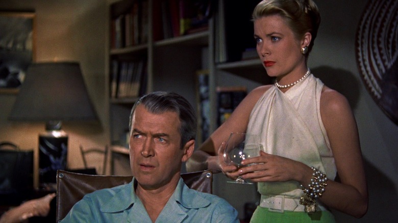 James Stewart and Grace Kelly look on in Rear Window