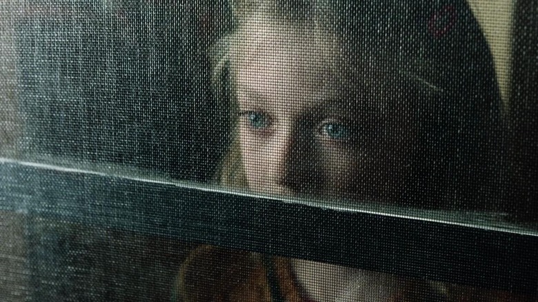 Dakota Fanning looking on terrified